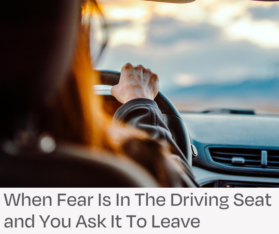 Woman driving a car. When fear is in the driving seat and you ask it to leave